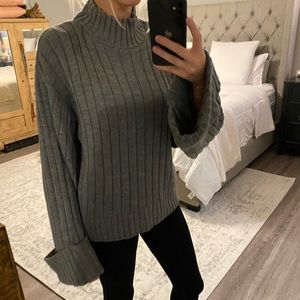 Turtleneck knit top with flare sleeves